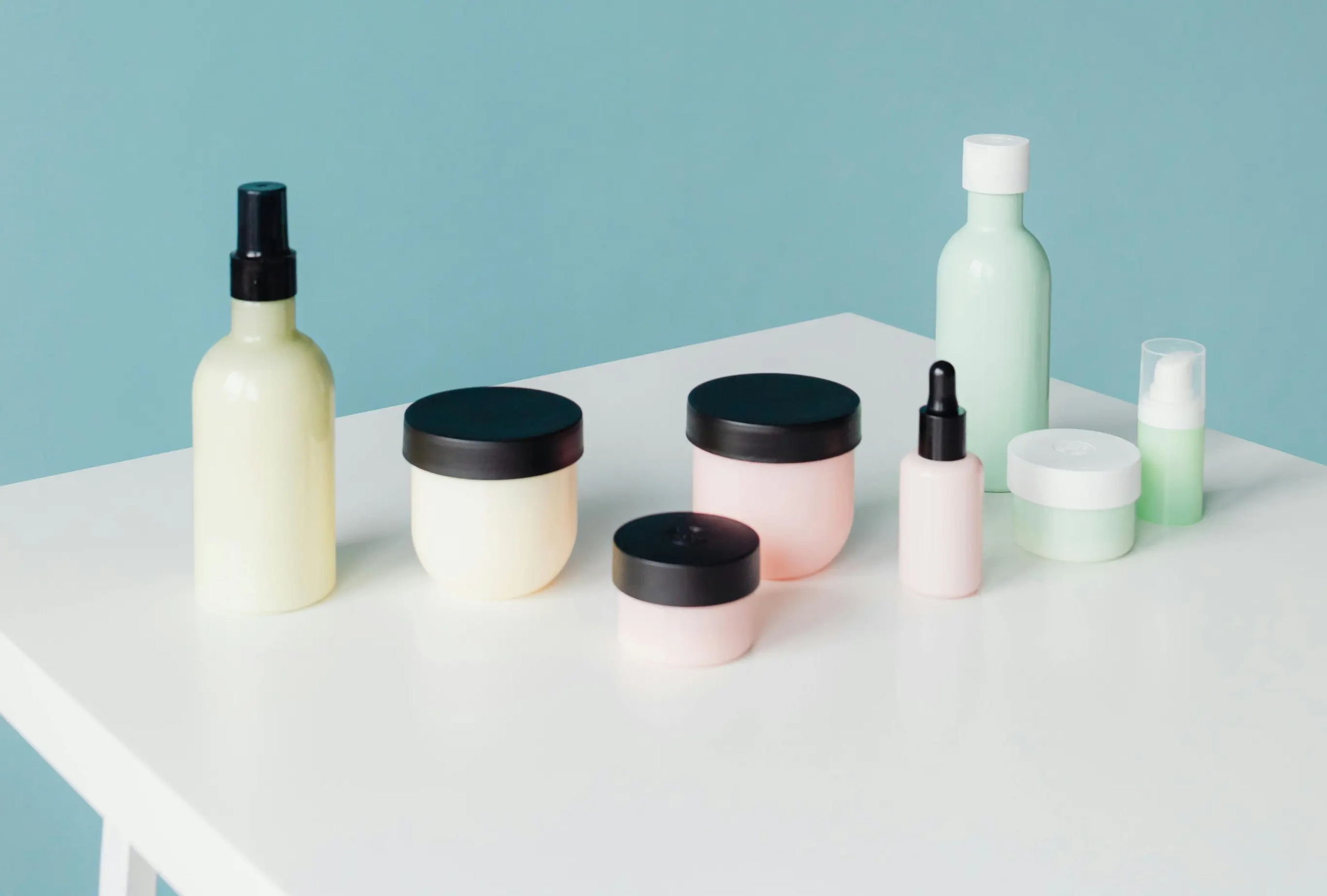 A variety of liquid packaging products arranged on top of a table.
