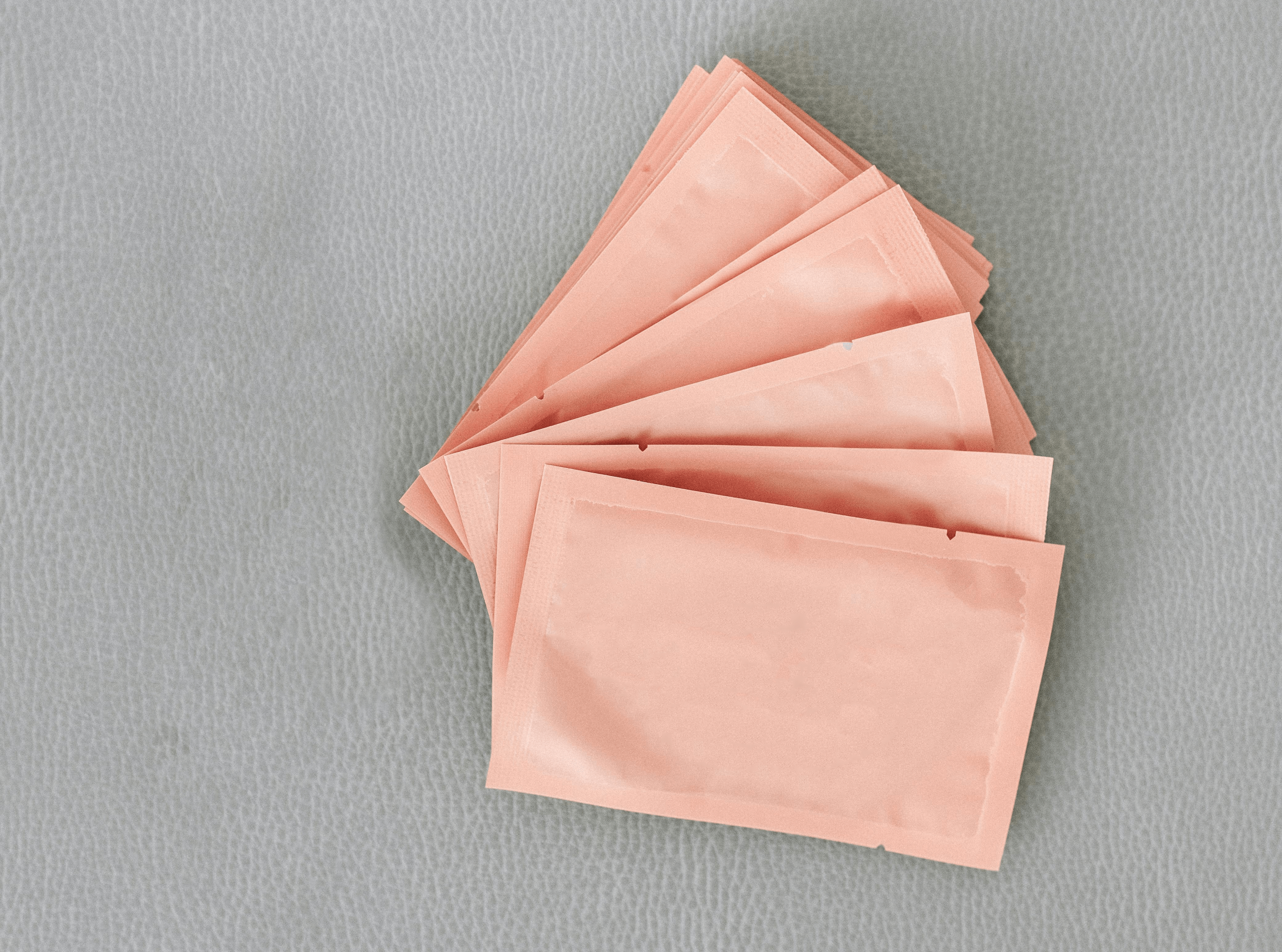 Close-up of small pink colored pharmaceutical packaging products